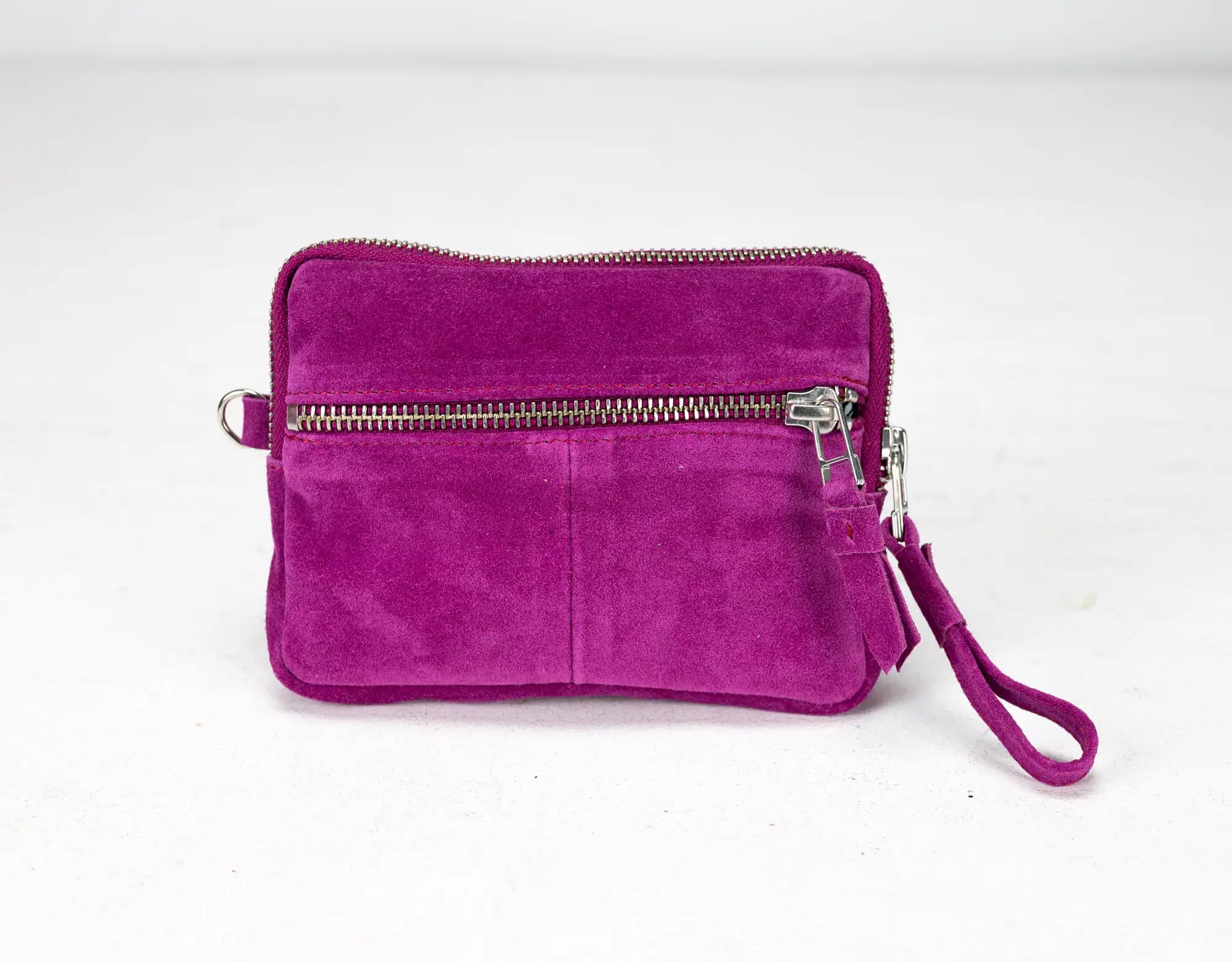Purple suede wristlet with a zipper on a white background