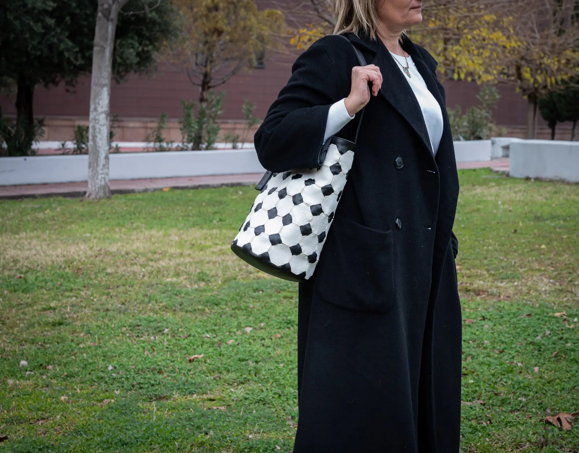 black and white rounfd leather bag