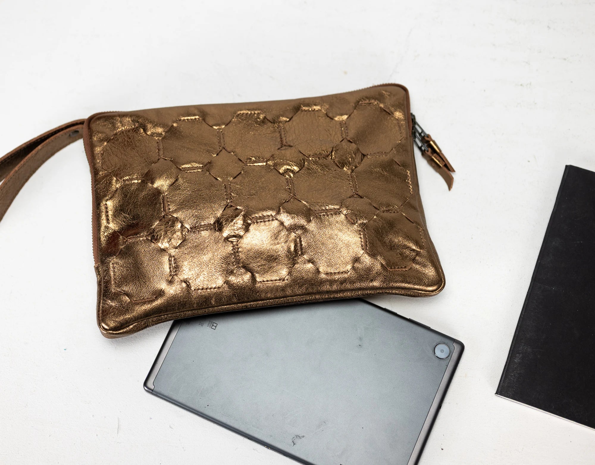 Bronze textured pouch on a white background