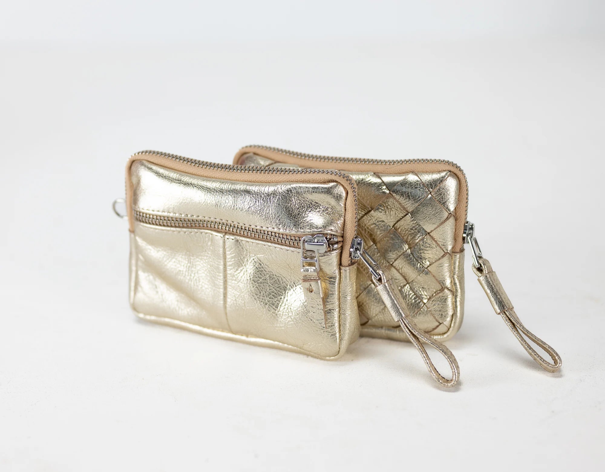Gold metallic clutch bag with woven pattern on a white background
