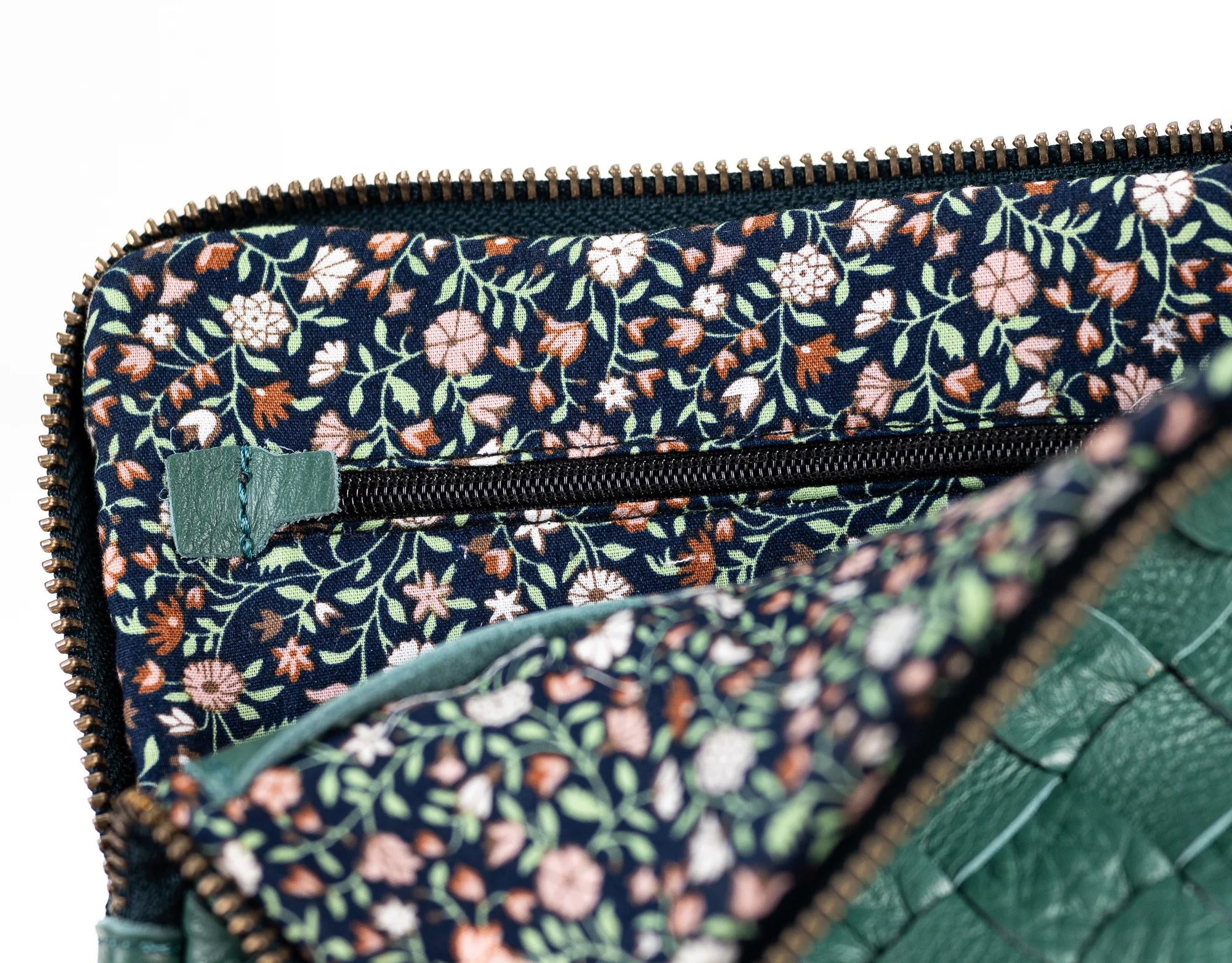 Floral patterned clutch bag with green accents
