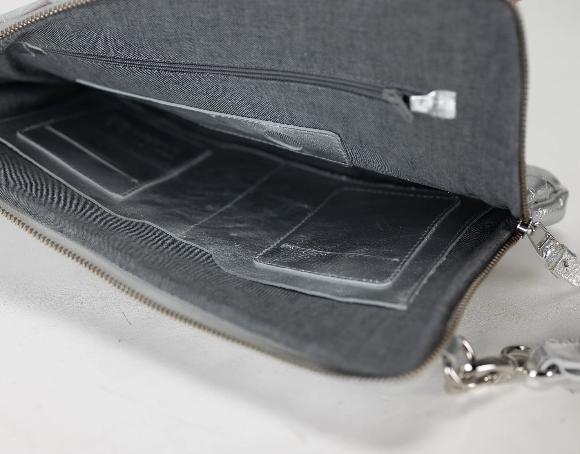Gray bag with a compartmentalized interior on a white background