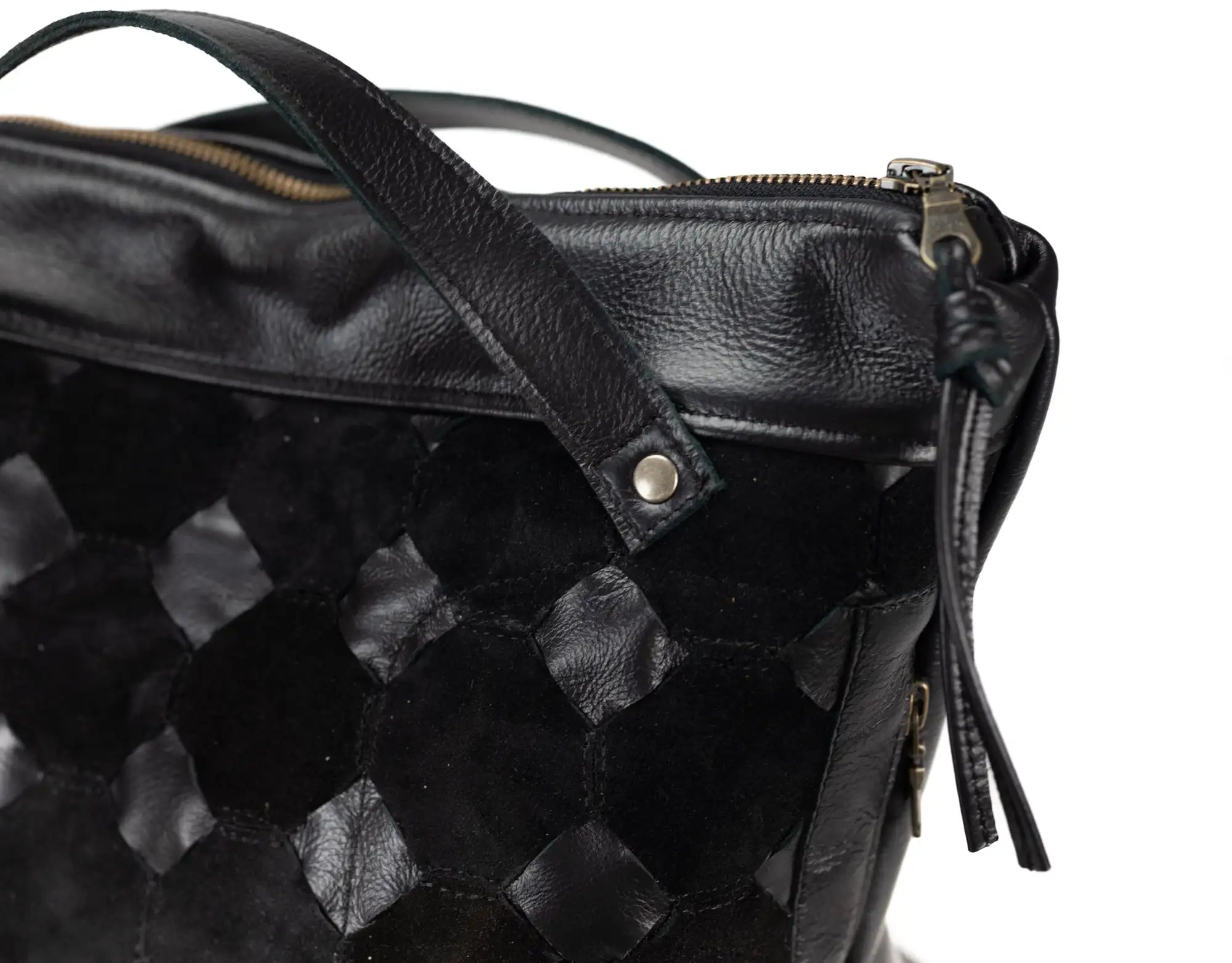 Black textured leather bag with a zipper on a white background
