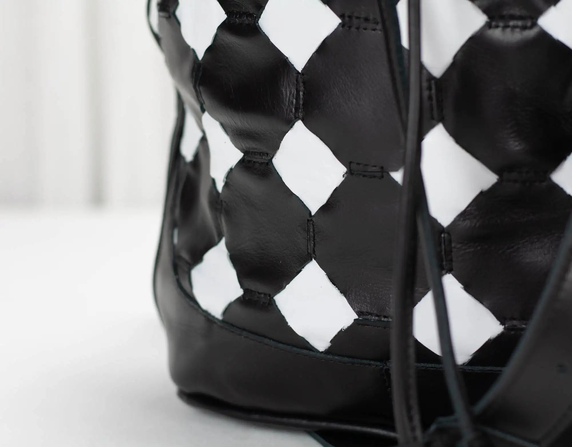 Black and white patterned bag on a light background