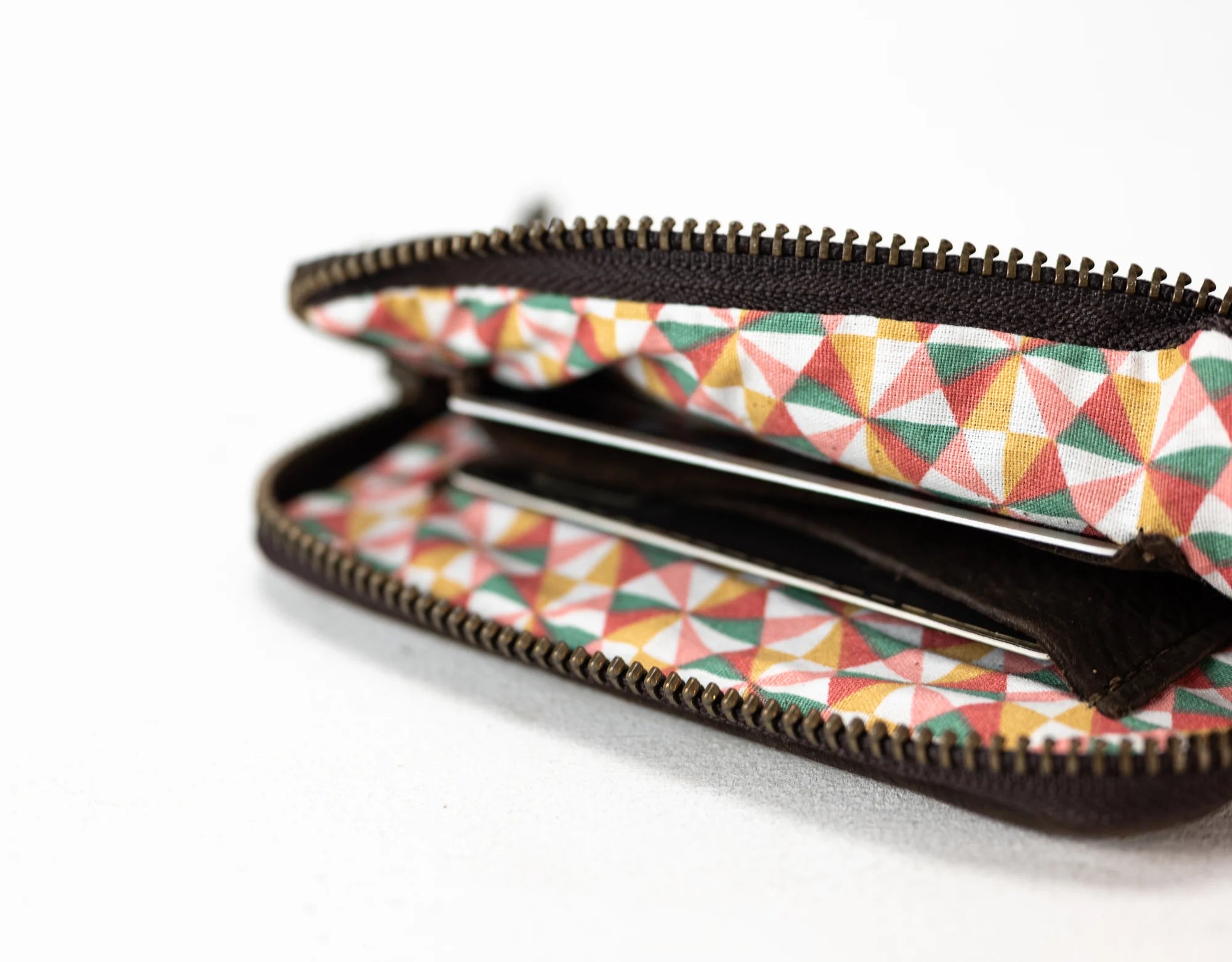 Zipped pouch with geometric pattern on a white background