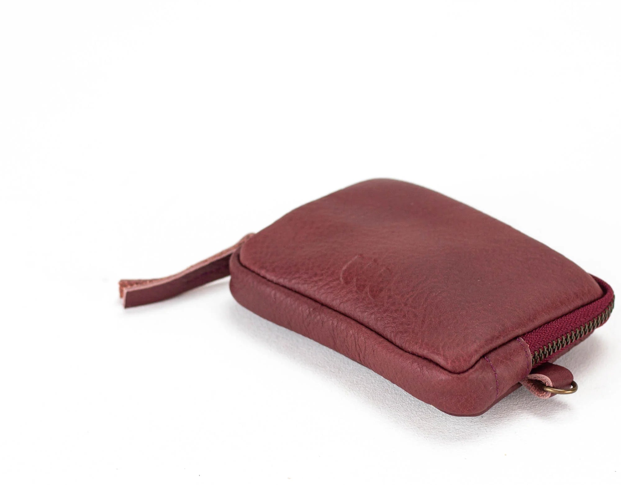 Red leather pouch on a white background