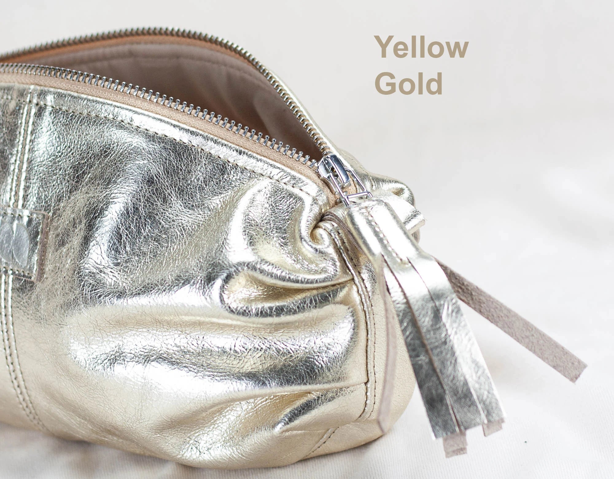 Silver pouch with a zipper on a white background