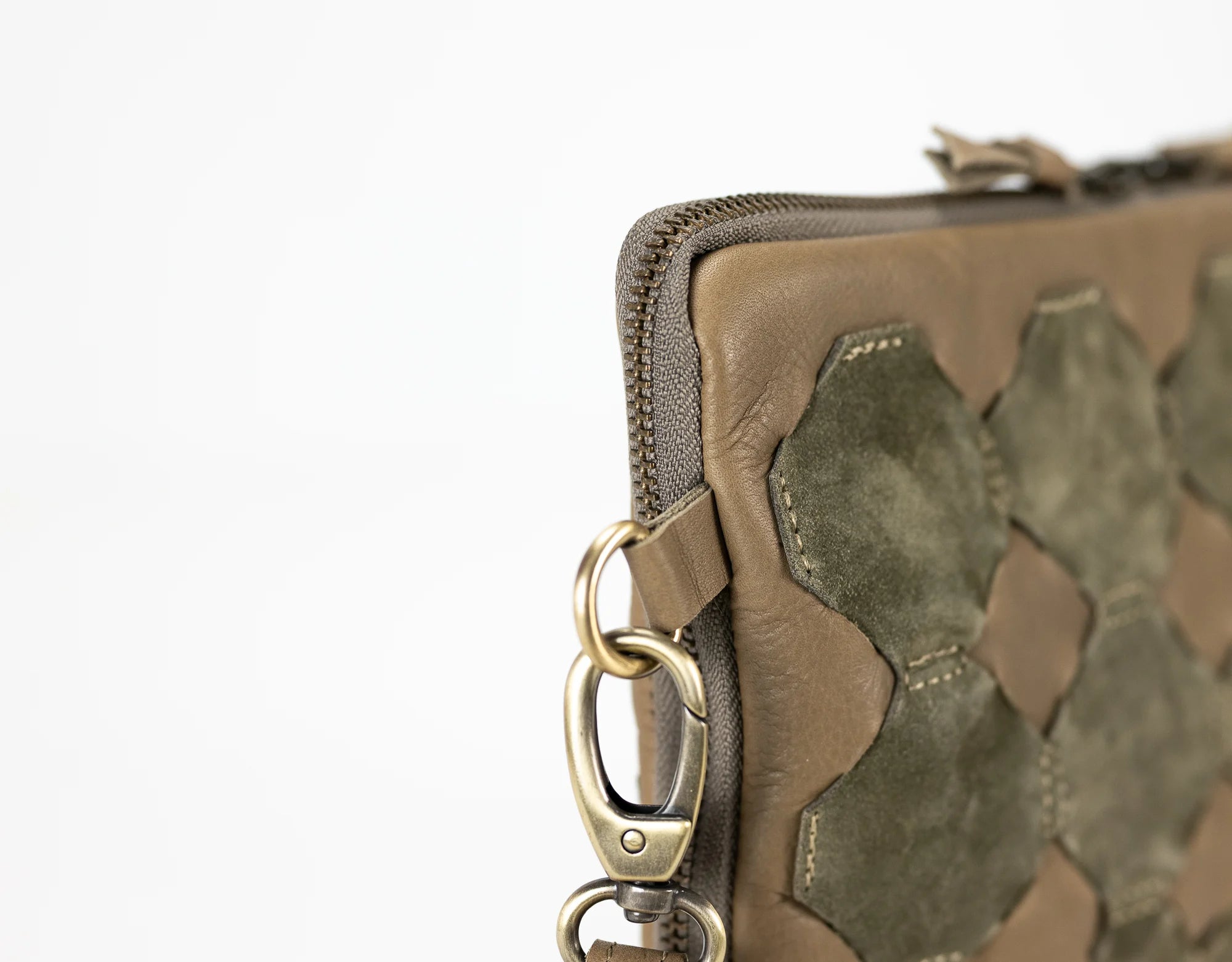 Brown leather wallet with a keychain on a white background