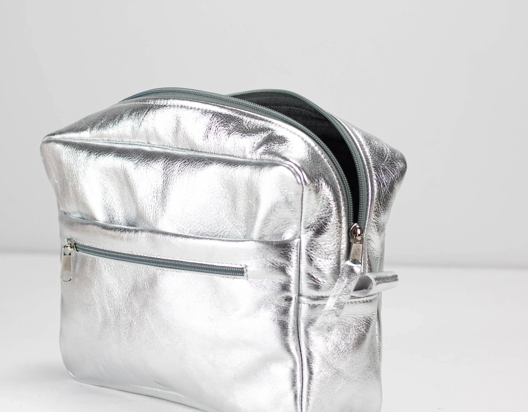 Silver bag insert on a light gray background