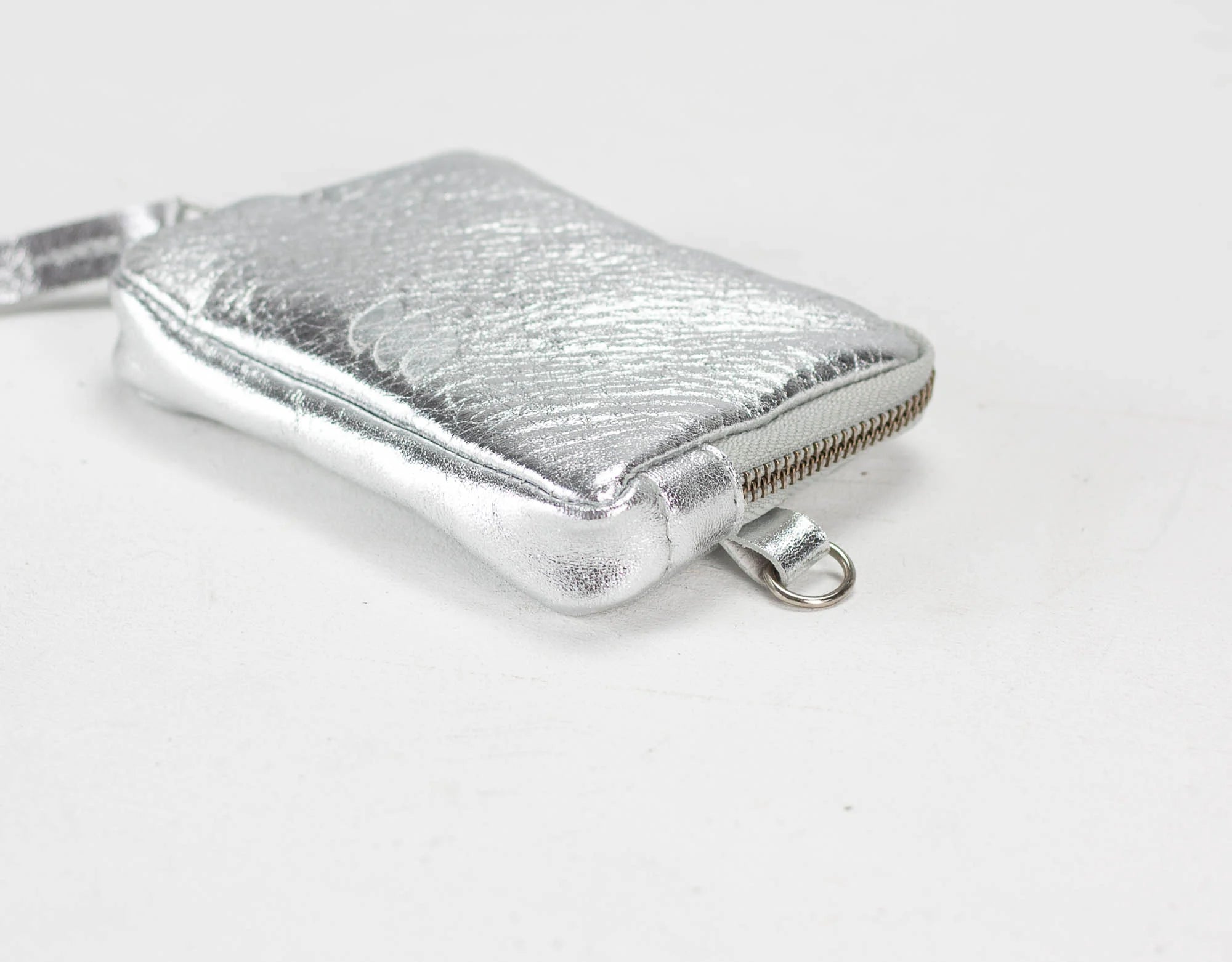 Silver textured wallet on a white background