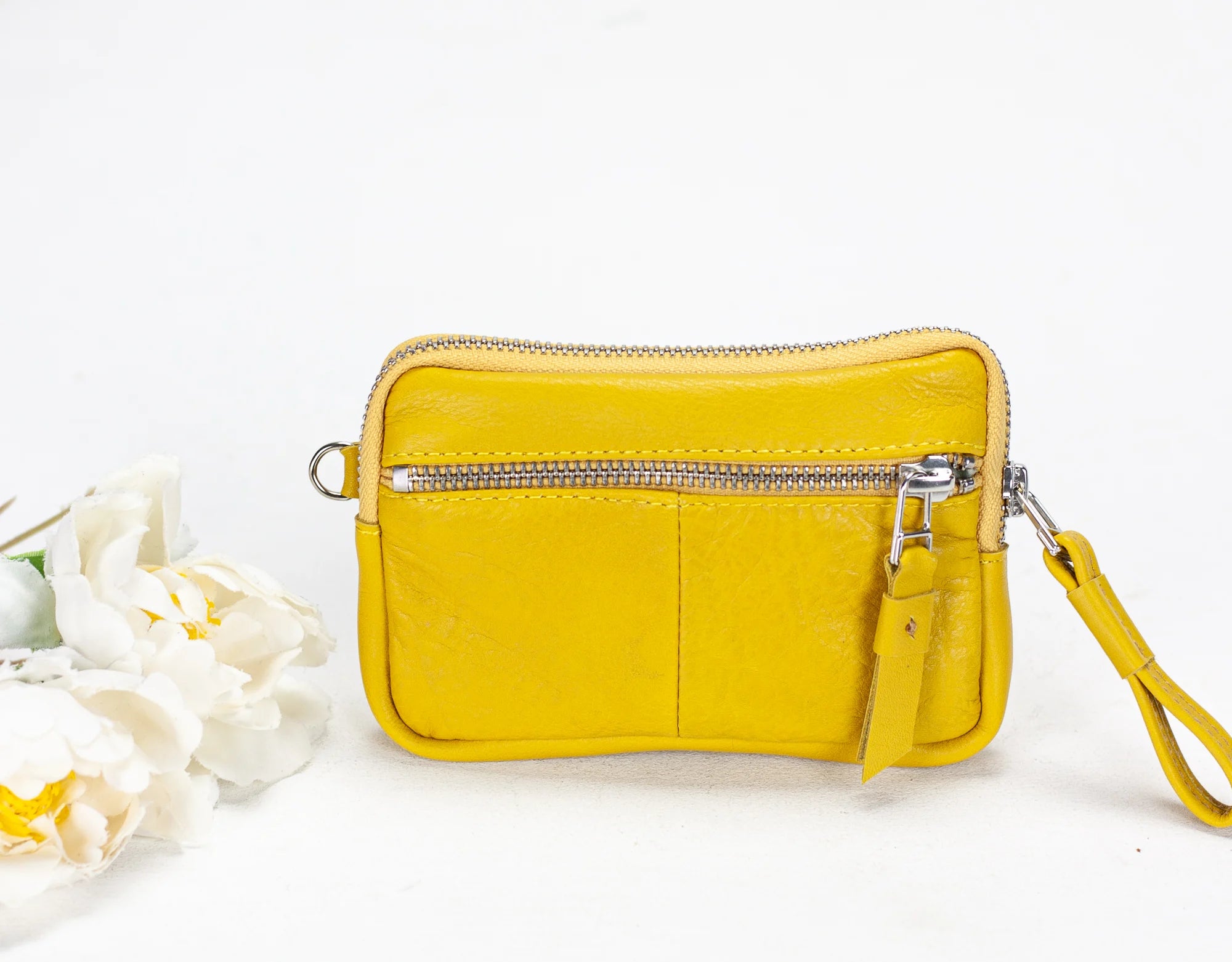 Yellow wallet with floral interior showing credit cards