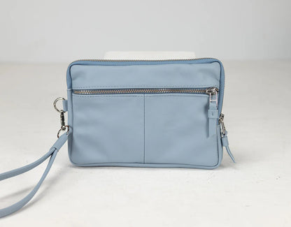 Light blue handbag with a strap on a white background
