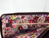 Floral patterned pouch with a zipper on a white background