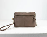 Brown leather crossbody bag on a white background