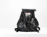 Black leather backpack on a white background