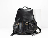 Black leather backpack on a white background