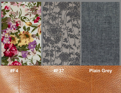Fabric swatches with floral, textured, and plain gray patterns on a brown background.