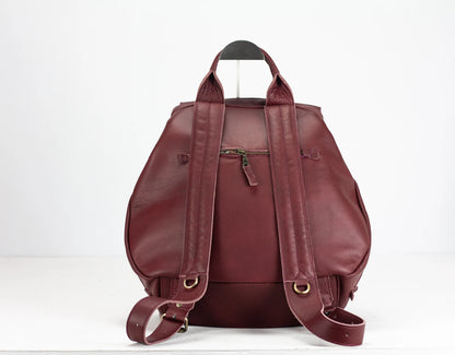 Maroon leather backpack on a white background