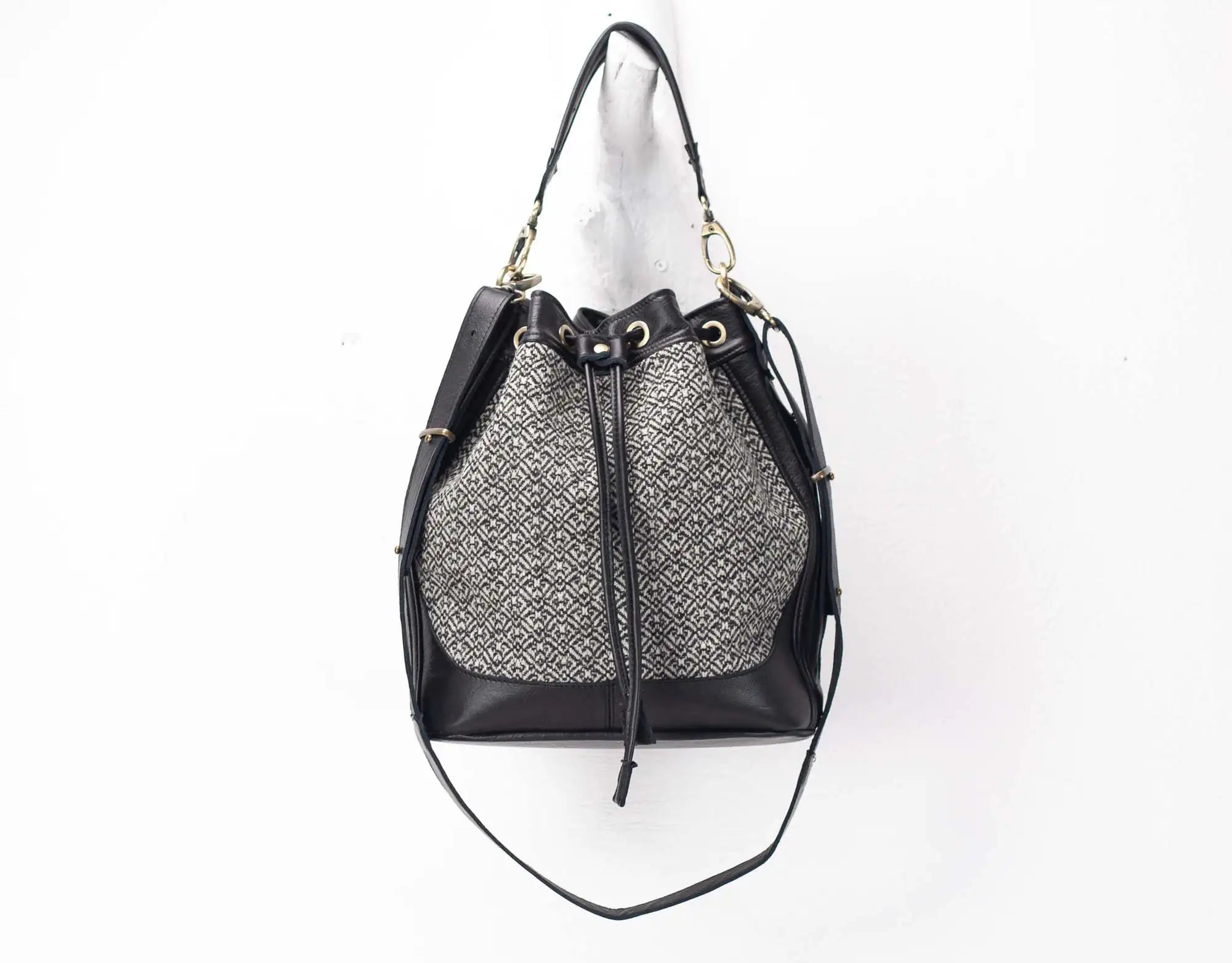 Black and gray patterned drawstring bag on a white background