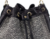 Close-up of a black and gray patterned bag with drawstring.