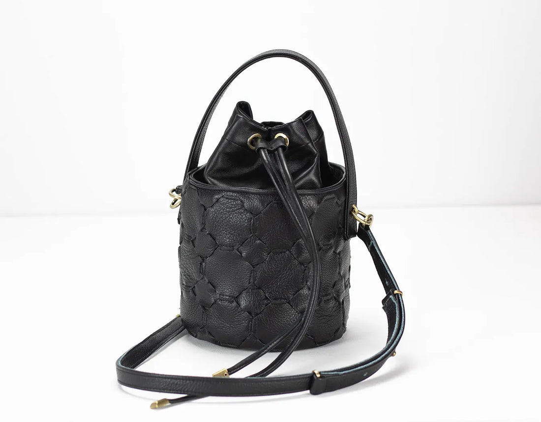 Black textured bucket bag on a white background