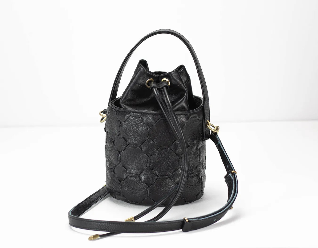 Black textured bucket bag on a white background