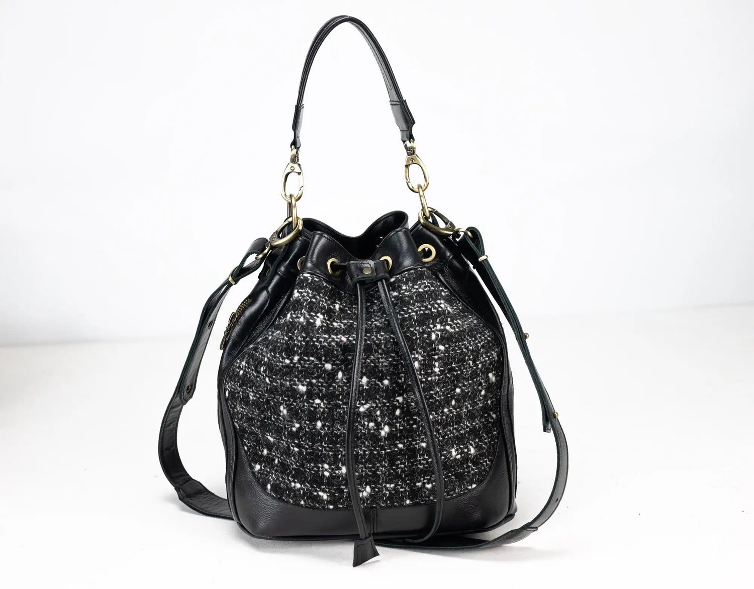 Black handbag with sparkling pattern on a white background