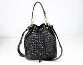 Black handbag with sparkling pattern on a white background