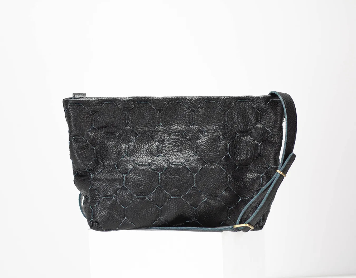 Black textured handbag on a white background
