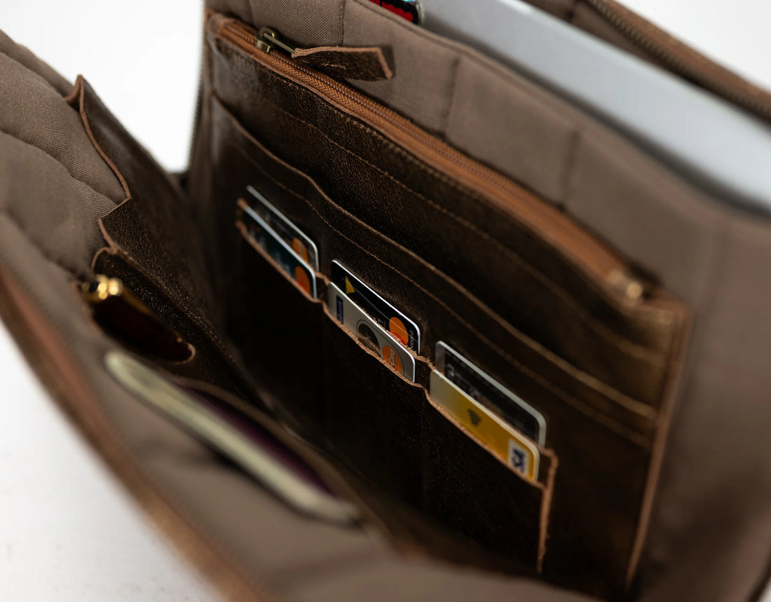 Brown leather wallet with multiple card slots on a white background