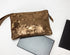 Bronze textured pouch on a white background