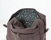 Brown cotton insert with floral interior lining on a white background 