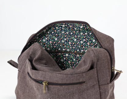 Brown cotton insert with floral interior lining on a white background 