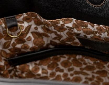 Floral-patterned strap on a black background