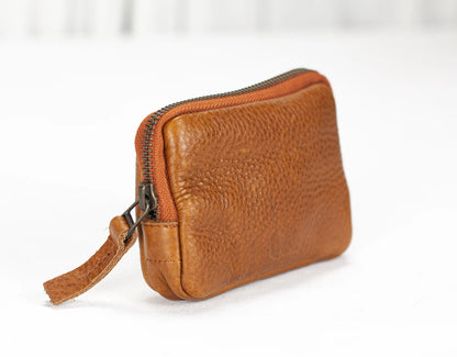 Brown leather wallet with a strap on a white background