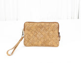 Beige woven clutch bag on a white background