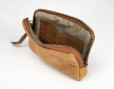 Brown leather pouch with crocodile texture lining on a white background