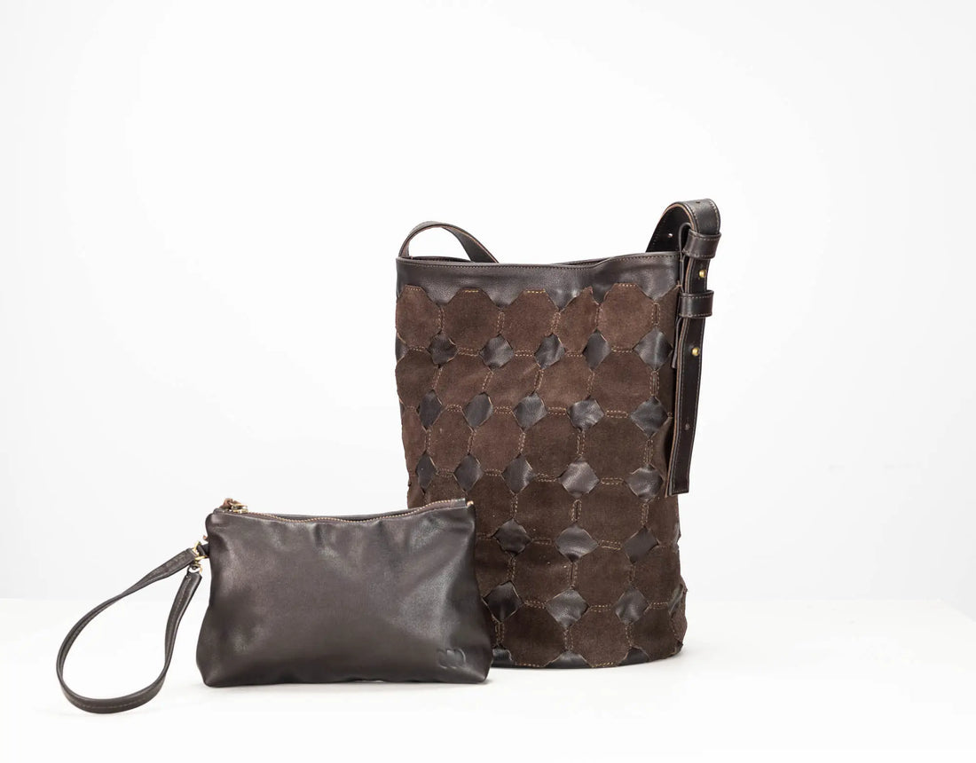 A dark brown leather shoulder bag with a distinctive raised geometric honeycomb pattern, shown next to a matching small leather wristlet pouch on a clean white background.