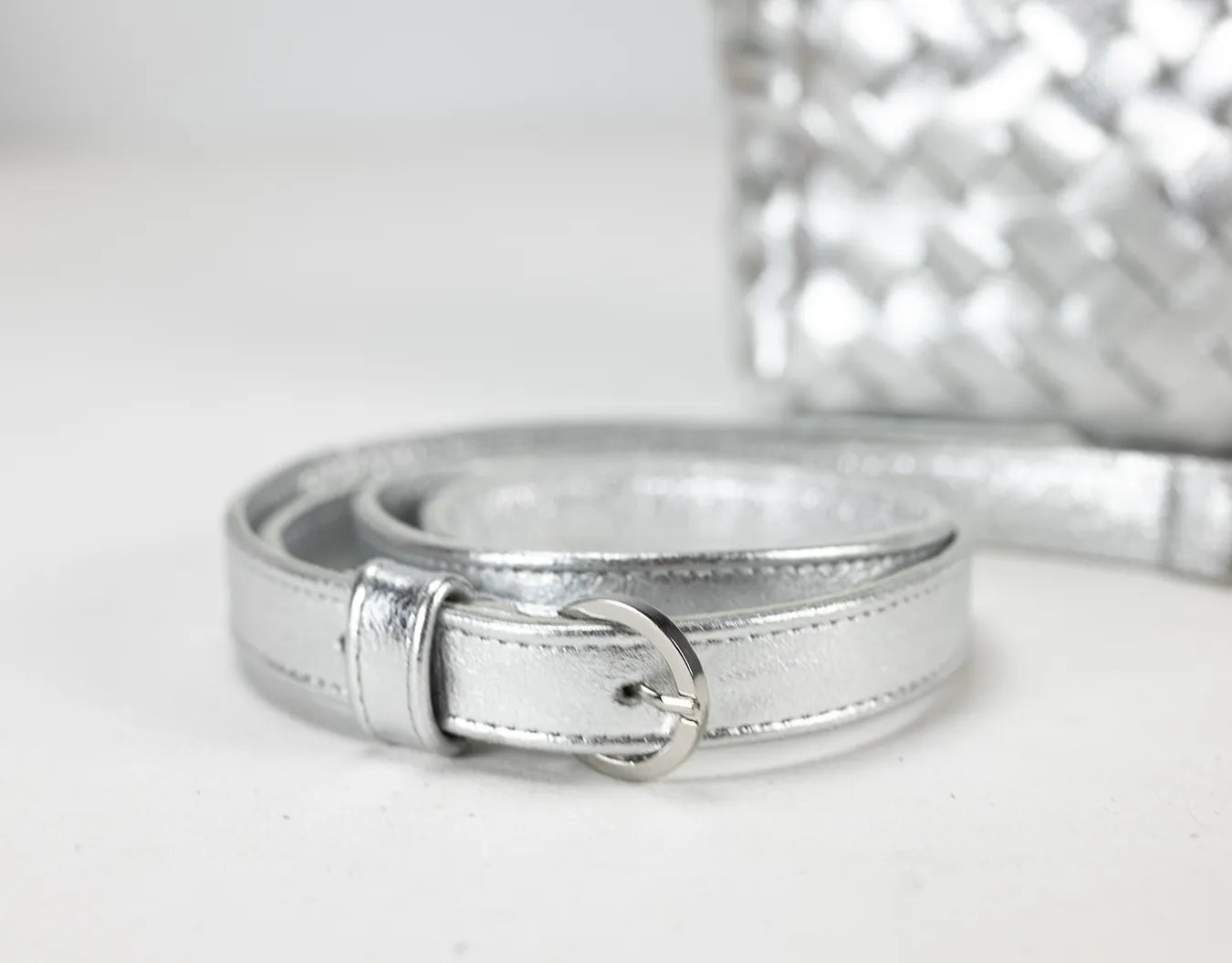 Silver belt on a light gray background