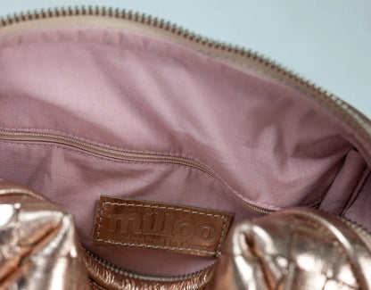 Close-up of a pink handbag with &