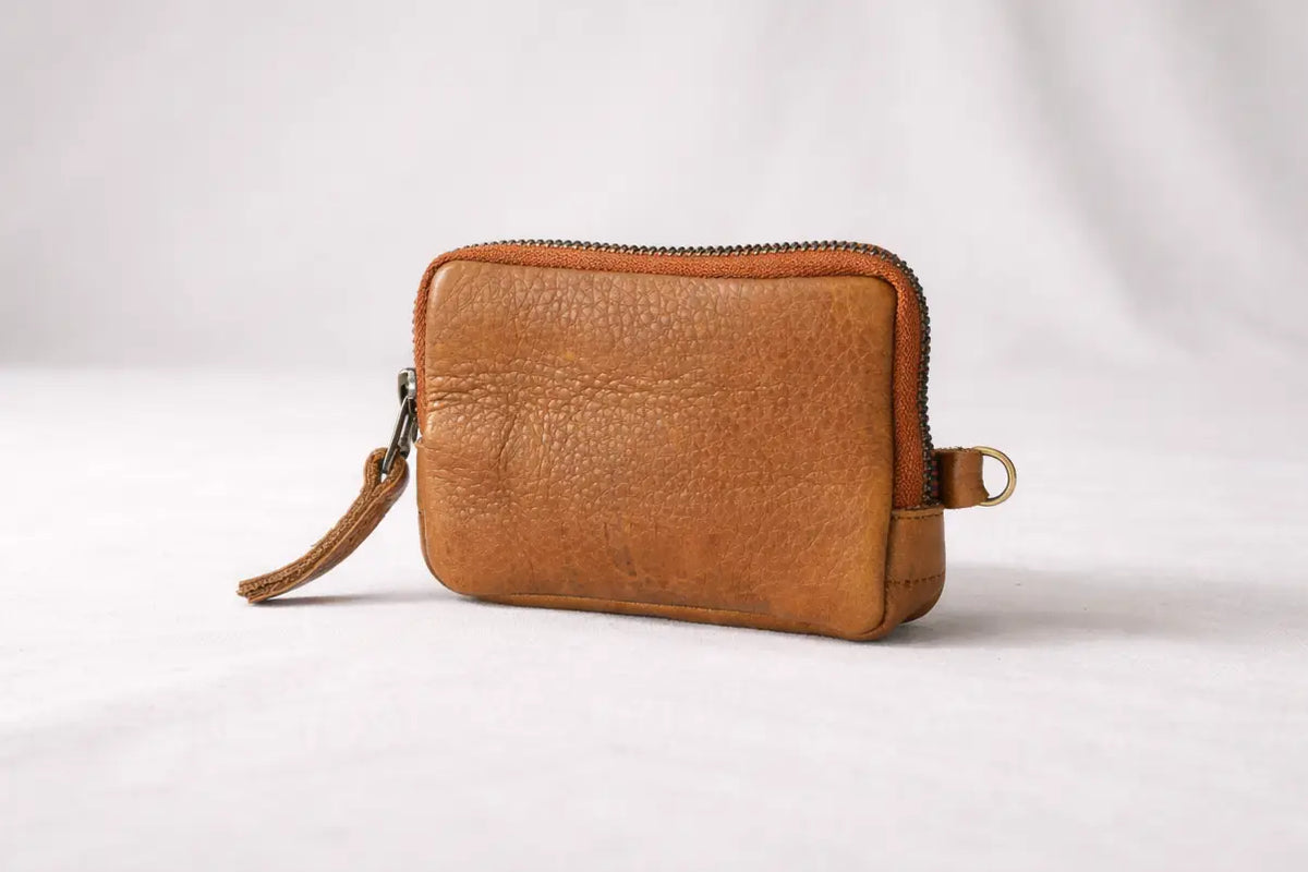 Brown leather wallet with a zipper tassel#color_brown-soft-pebbled