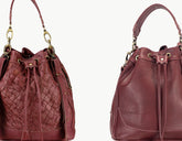 Two views of a maroon leather handbag with drawstring top.