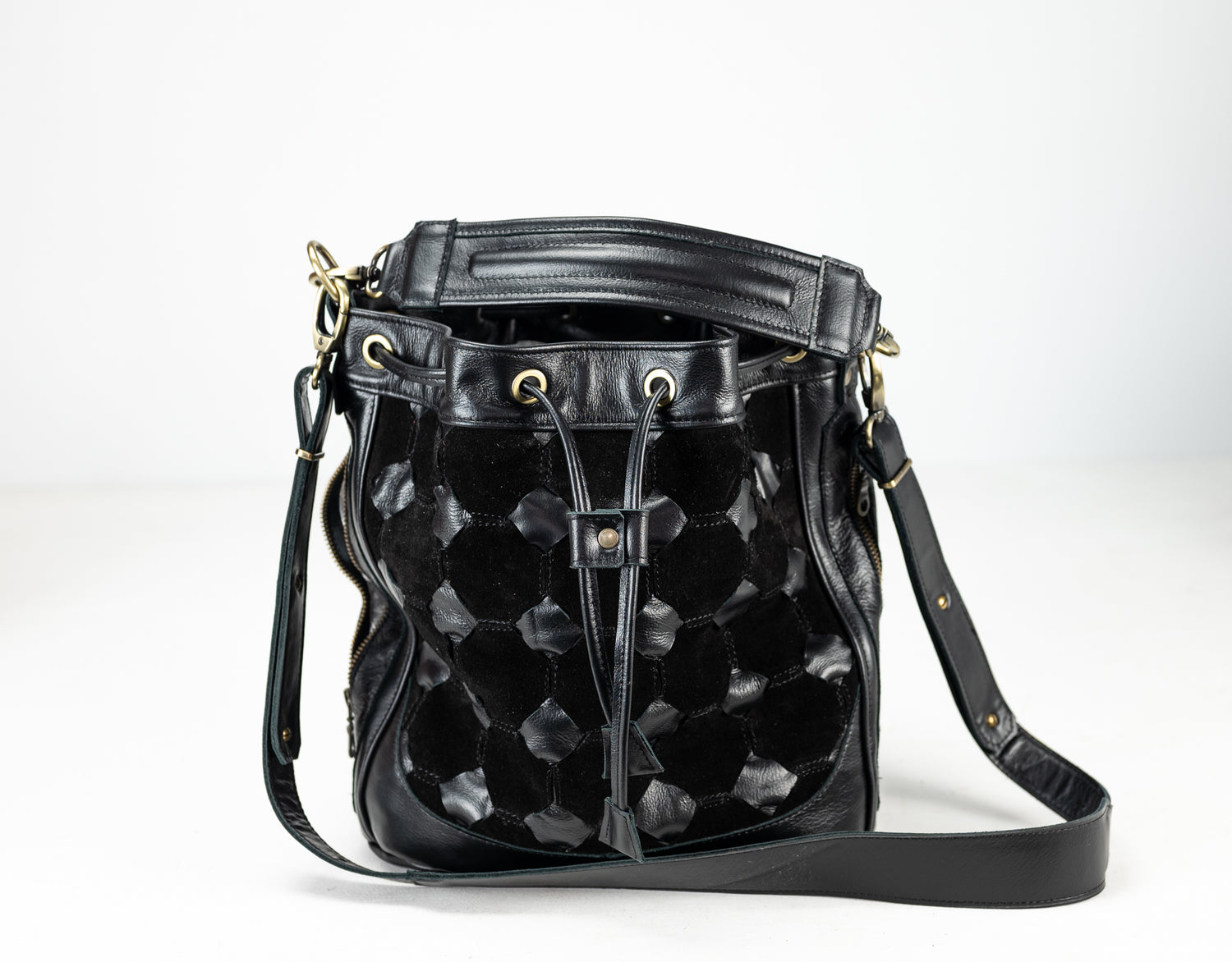 Black quilted leather bucket bag on a white background