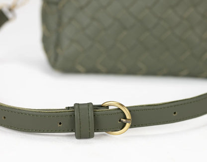 Green belt with a gold buckle on a white background