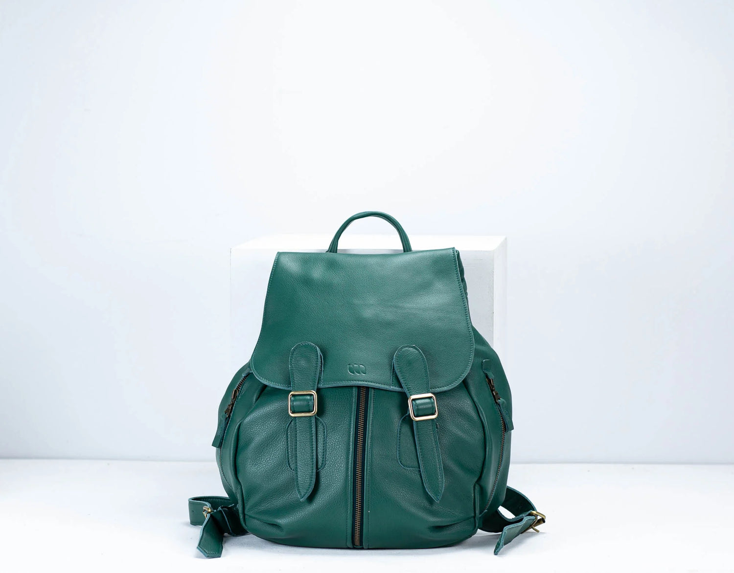Green backpack on a white background