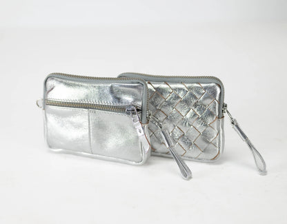 Silver quilted wallet with a strap on a white background