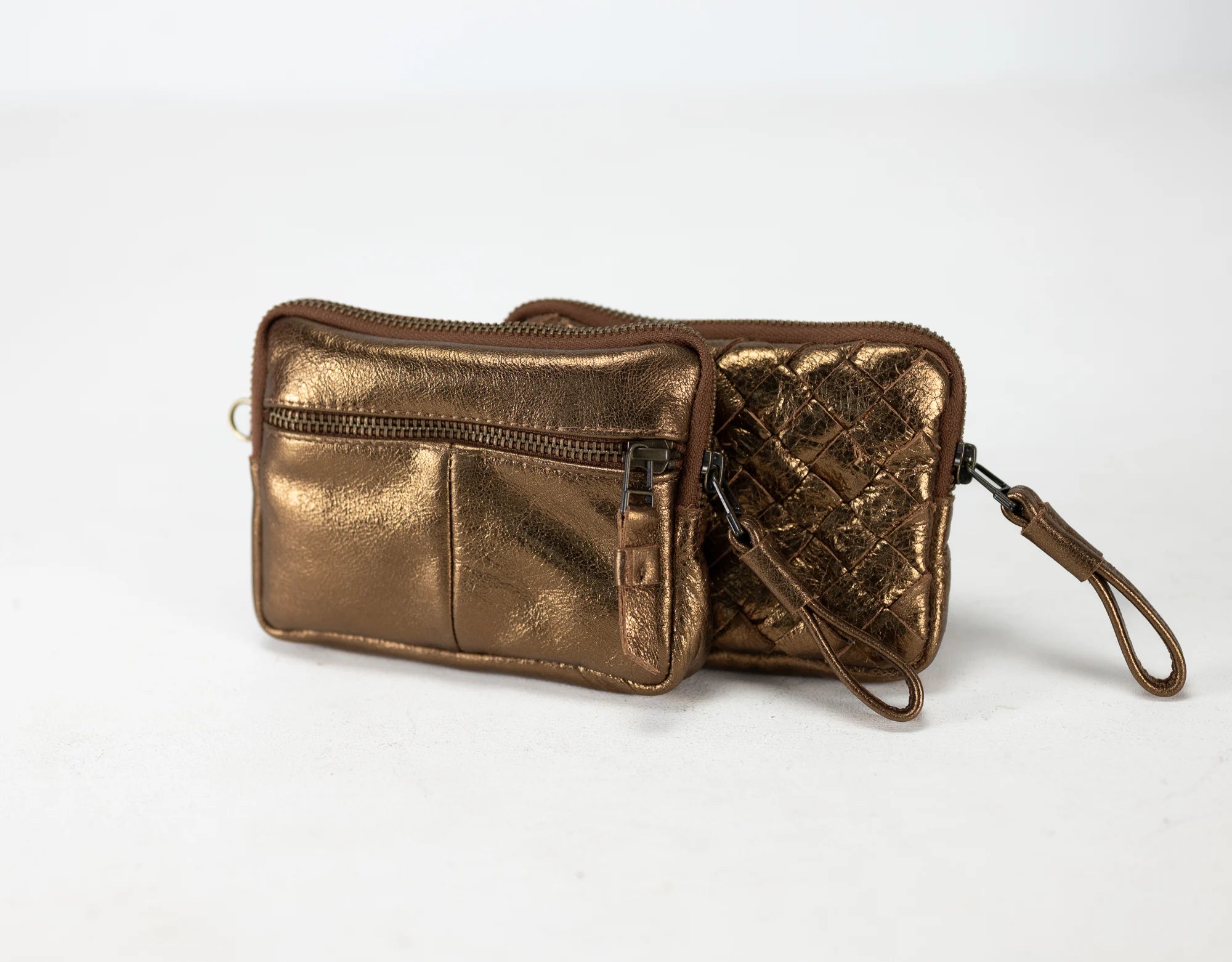 Bronze metallic wallet with a strap on a white background