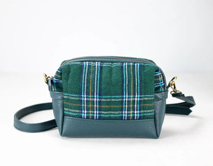 Green plaid crossbody bag on a white background