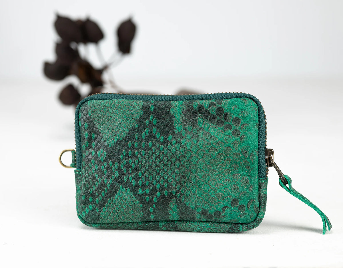 Green snake skin patterned pouch on a white background