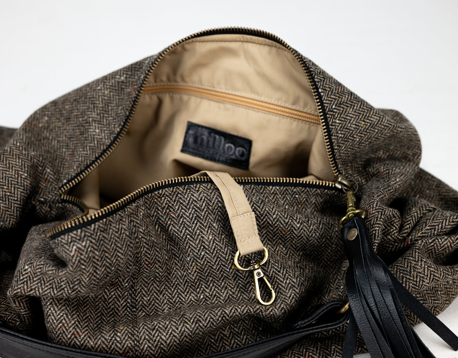 Brown textured bag with a visible brand label on a white background